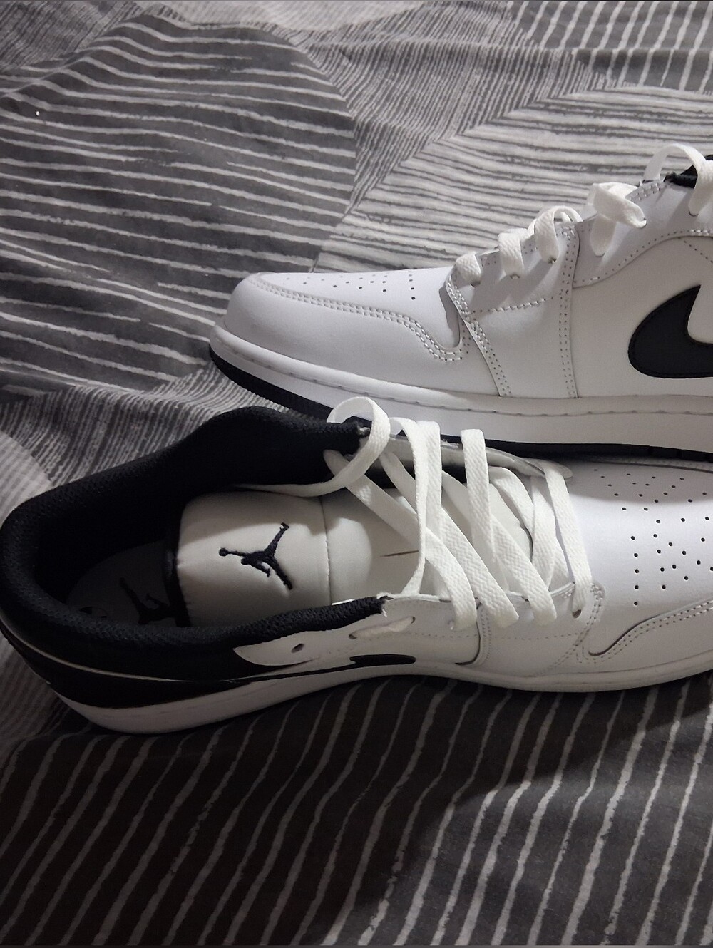 Jordan 1 Low-Top White Sneakers with Black Swoosh